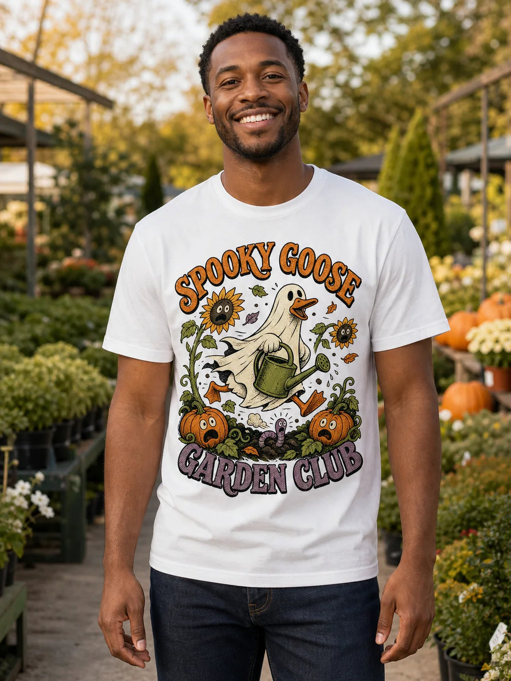 Man wearing a Spooky Goose Garden Club Halloween graphic T-shirt at a plant nursery