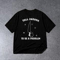 TALL ENOUGH TO BE A PROBLEM FUNNY SHORT PERSON T-SHIRT on light gray concrete